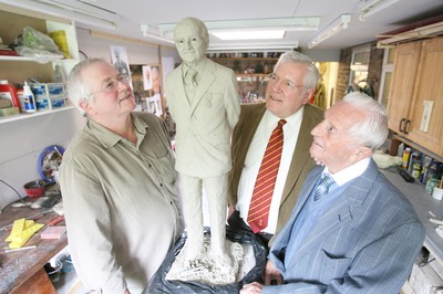 22.04.09 Welsh Rugby... L-r Sculptor Roger Andrews, Dennis Gethin President of the Welsh Rugby Union and Stan Thomas with the design for the statue of Sir Tasker Watkins which is nearing completion. 