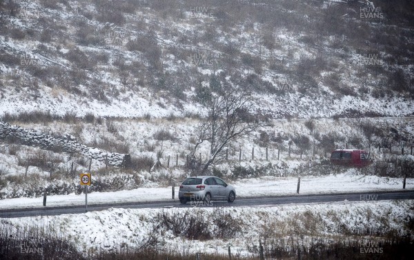 081217 - Weather - Picture shows a car traveling through the snow in the Brecon Beacons near Methyr Tydfil