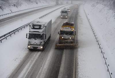 180113 - M4- Snow -   A Snow plough attempts to keep the M4 at Cardiff open as snow falls heavily in South Wales 