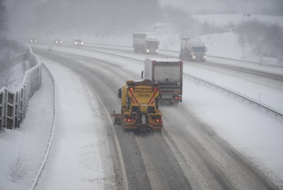 180113 - M4- Snow -   A Snow plough attempts to keep the M4 at Cardiff open as snow falls heavily in South Wales 