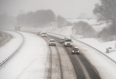 180113 - M4- Snow -   A general view of the M4 at Cardiff as snow falls heavily in South Wales 