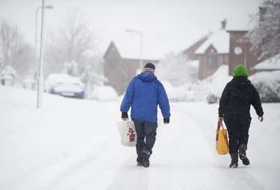 180113 - Cardiff- Snow -   Shoppers brave the conditions as snow falls heavily in South Wales 