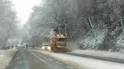 180113 - Snow hits south Wales -Snow ploughs at work on the roads near Abercynon, south Wales