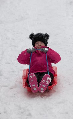 180113 - Snow hits south Wales -Grace Mantle, aged 5 from Mountain Ash, tries out her sledge