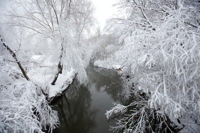 180113 - Snow hits south Wales -Snow creates a magical scene over one of the small rivers near Hirwain, south Wales