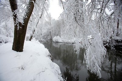 180113 - Snow hits south Wales -Snow creates a magical scene over one of the small rivers near Hirwain, south Wales