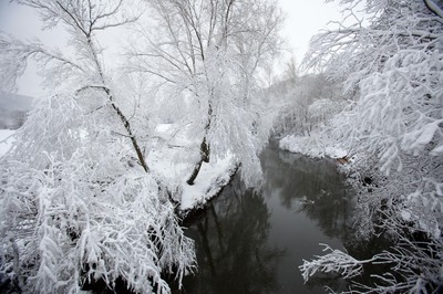 180113 - Snow hits south Wales -Snow creates a magical scene over one of the small rivers near Hirwain, south Wales