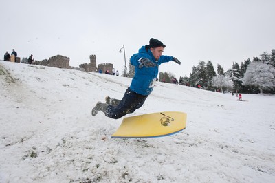 180113 - Snow hits south Wales -Sledgers take to the snow at Cyfarthfa Castle in Merthyr Tydfil