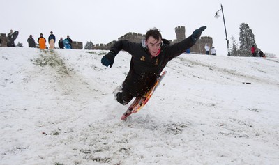 180113 - Snow hits south Wales -Sledgers take to the snow at Cyfarthfa Castle in Merthyr Tydfil