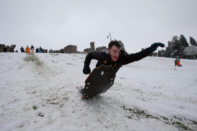 180113 - Snow hits south Wales -Sledgers take to the snow at Cyfarthfa Castle in Merthyr Tydfil