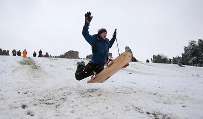 180113 - Snow hits south Wales -Sledgers take to the snow at Cyfarthfa Castle in Merthyr Tydfil