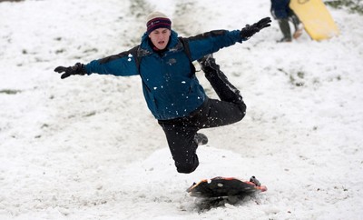 180113 - Snow hits south Wales -Sledgers take to the snow at Cyfarthfa Castle in Merthyr Tydfil