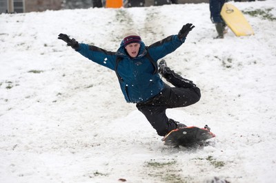 180113 - Snow hits south Wales -Sledgers take to the snow at Cyfarthfa Castle in Merthyr Tydfil