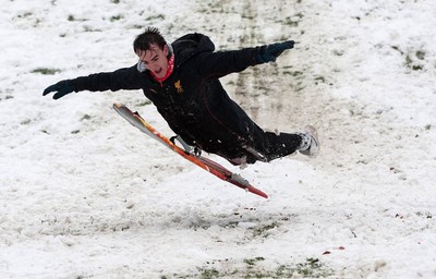 180113 - Snow hits south Wales -Sledgers take to the snow at Cyfarthfa Castle in Merthyr Tydfil