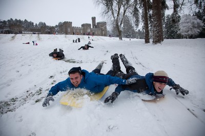 180113 - Snow hits south Wales -Sledgers take to the snow at Cyfarthfa Castle in Merthyr Tydfil