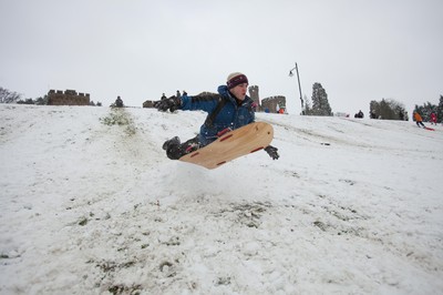 180113 - Snow hits south Wales -Sledgers take to the snow at Cyfarthfa Castle in Merthyr Tydfil