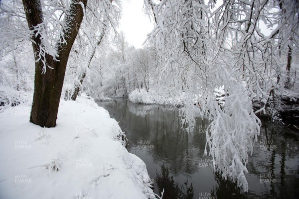 180113 - Snow hits south Wales -Snow creates a magical scene over one of the small rivers near Hirwain, south Wales