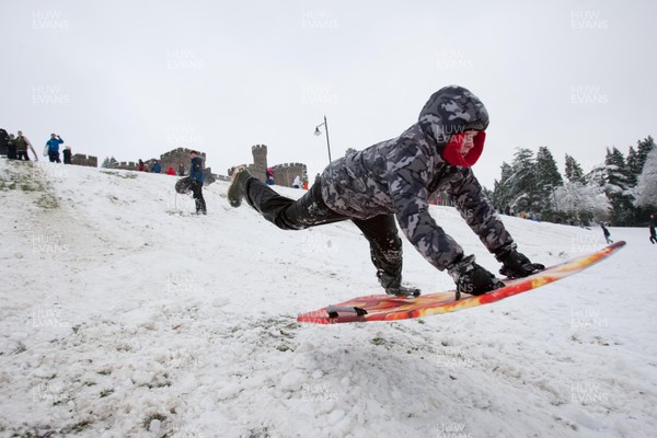 180113 - Snow hits south Wales -Sledgers take to the snow at Cyfarthfa Castle in Merthyr Tydfil