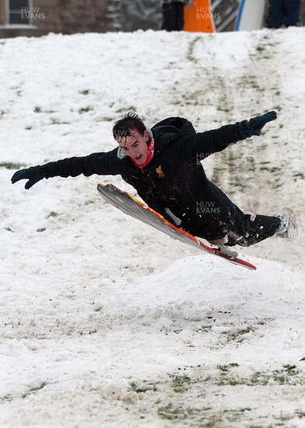 180113 - Snow hits south Wales -Sledgers take to the snow at Cyfarthfa Castle in Merthyr Tydfil