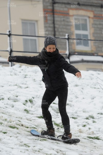 180113 - Heavy Snowfall in South Wales -Children and adults enjoy sledging in the snow in Penarth near Cardiff following heavy snowfall in South Wales