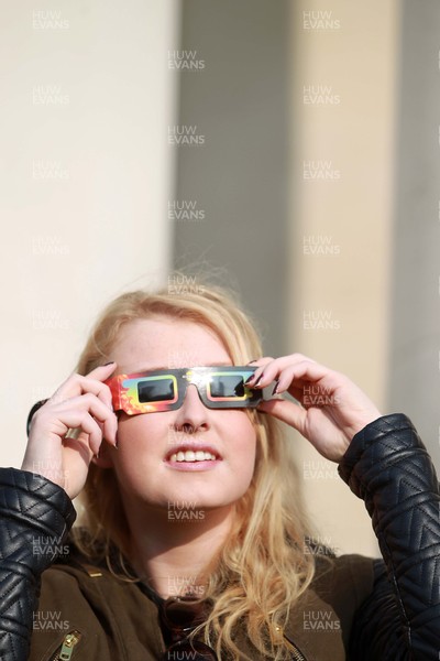 200315 - Picture shows people watching the solar eclipse on the steps of the National Museum, Cardiff