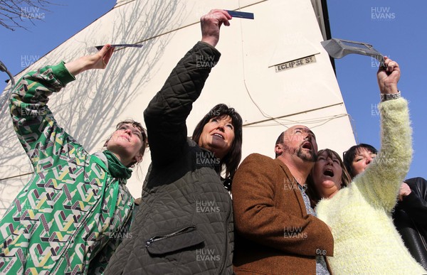 200315 - Picture shows residents of Eclipse Street, Adamstown, Cardiff watching the solar eclipse