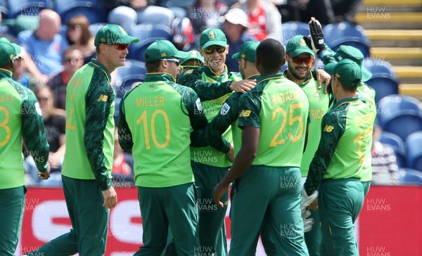 150619 - South Africa v Afghanistan - ICC Cricket World Cup 2019 - Rassie van der Dussen of South Africa celebrating with team mates catching Hazratullah Zazai