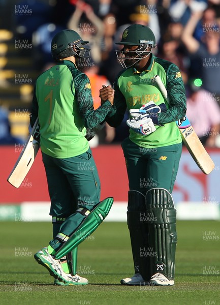 150619 - South Africa v Afghanistan - ICC Cricket World Cup 2019 - Andile Phehlukwayo of South Africa celebrates with Hashim Amla after winning the game