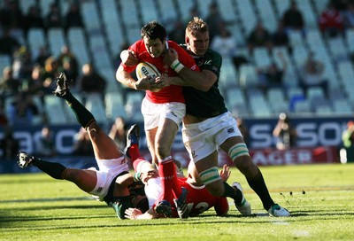 07.06.08 South Africa v Wales, Bloemfontein... Wales Stephen Jones is tackled by South Africa's Andries Bekker.   