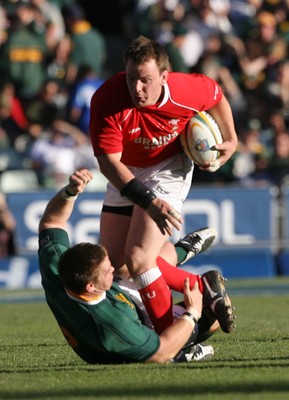 07.06.08 South Africa v Wales, Bloemfontein... Wales Matthew Rees gets tackled by South Africa's John Smit.   