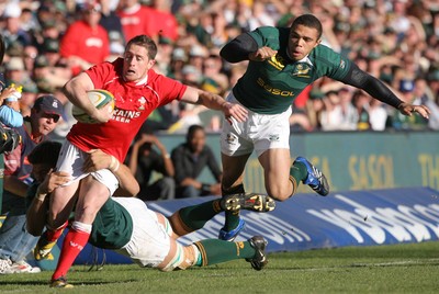 07.06.08 South Africa v Wales, Bloemfontein... Wales Shane Williamsis bundled into touch by South Africa's Juan Smith.   