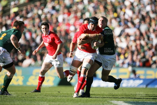 07.06.08 South Africa v Wales, Bloemfontein... Wales Jonathan Thomas is tackled by South Africa's Jean de Villiers.   