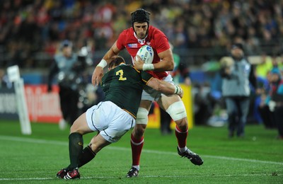 11.09.11 - South Africa v Wales - Rugby World Cup 2011 - Luke Charteris of Wales is tackled by John Smit of South Africa. 