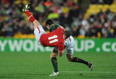 11.09.11 - South Africa v Wales - Rugby World Cup 2011 - Shane Williams of Wales is tackled by Jaque Fourie of South Africa. 