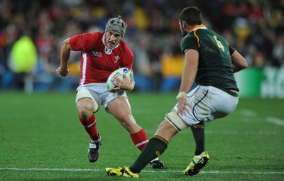 11.09.11 - South Africa v Wales - Rugby World Cup 2011 - Jonathan Davies of Wales takes on Danie Rossouw of South Africa. 