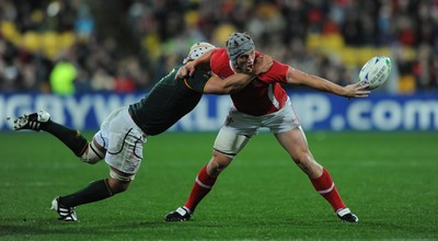 11.09.11 - South Africa v Wales - Rugby World Cup 2011 - Jonathan Davies of Wales tries to get the ball away. 