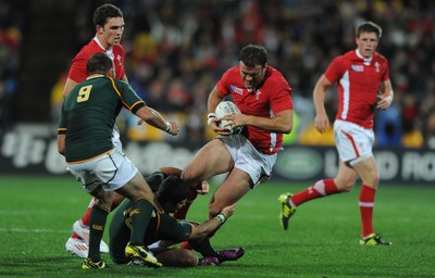 11.09.11 - South Africa v Wales - Rugby World Cup 2011 - Jamie Roberts of Wales is tackled by Morne Steyn of South Africa. 