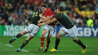 11.09.11 - South Africa v Wales - Rugby World Cup 2011 - Rhys Priestland of Wales is tackled by Butch James and Francois Hougaard of South Africa. 