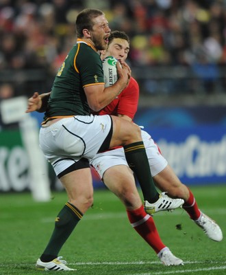 11.09.11 - South Africa v Wales - Rugby World Cup 2011 - Frans Steyn of South Africa is tackled by George North of Wales. 