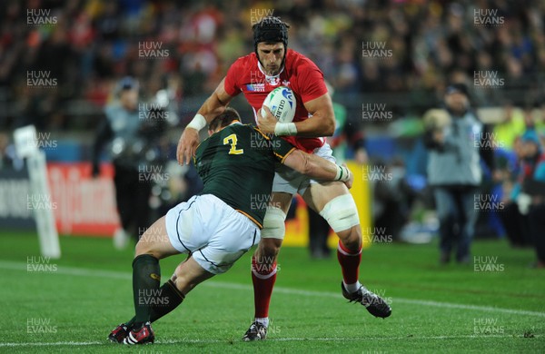 11.09.11 - South Africa v Wales - Rugby World Cup 2011 - Luke Charteris of Wales is tackled by John Smit of South Africa. 