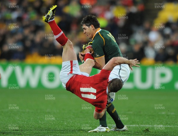 11.09.11 - South Africa v Wales - Rugby World Cup 2011 - Shane Williams of Wales is tackled by Jaque Fourie of South Africa. 