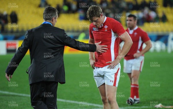 11.09.11 - South Africa v Wales - Rugby World Cup 2011 - Rhys Priestland of Wales is consoled by attack coach Rob Howley. 