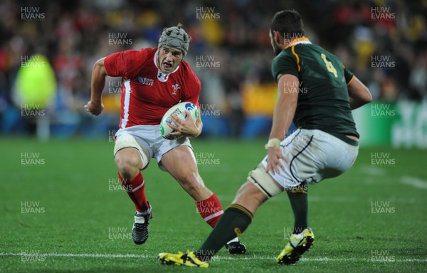 11.09.11 - South Africa v Wales - Rugby World Cup 2011 - Jonathan Davies of Wales takes on Danie Rossouw of South Africa. 