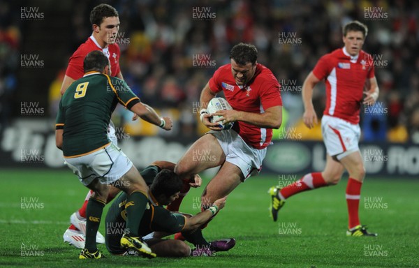 11.09.11 - South Africa v Wales - Rugby World Cup 2011 - Jamie Roberts of Wales is tackled by Morne Steyn of South Africa. 