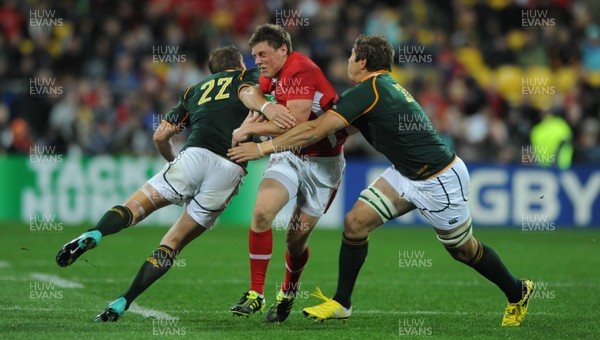 11.09.11 - South Africa v Wales - Rugby World Cup 2011 - Rhys Priestland of Wales is tackled by Butch James and Francois Hougaard of South Africa. 