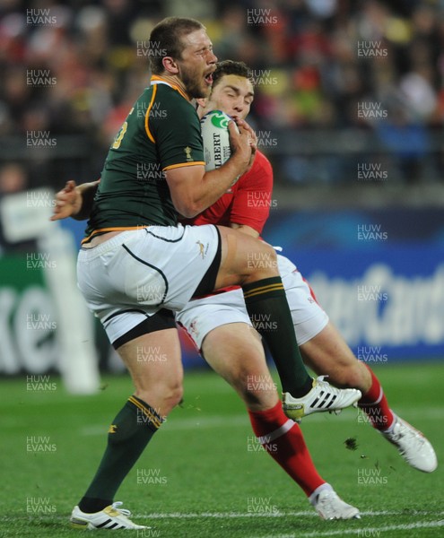 11.09.11 - South Africa v Wales - Rugby World Cup 2011 - Frans Steyn of South Africa is tackled by George North of Wales. 