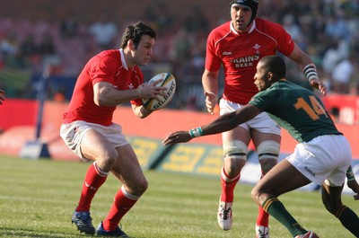 14.06.08 South Africa v Wales (Second Test)... Wales' Stephen Jones takes on South Africa's Tonderai Chavhanga 