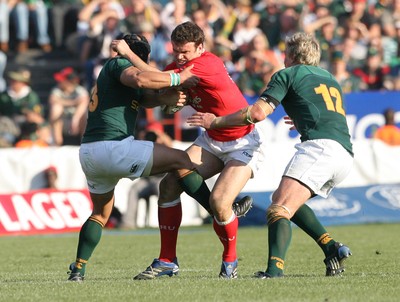 14.06.08 South Africa v Wales (Second Test)... Wales' Jamie Roberts is tackled by South Africa's Adrian Jacobs and Jean de Villiers. 