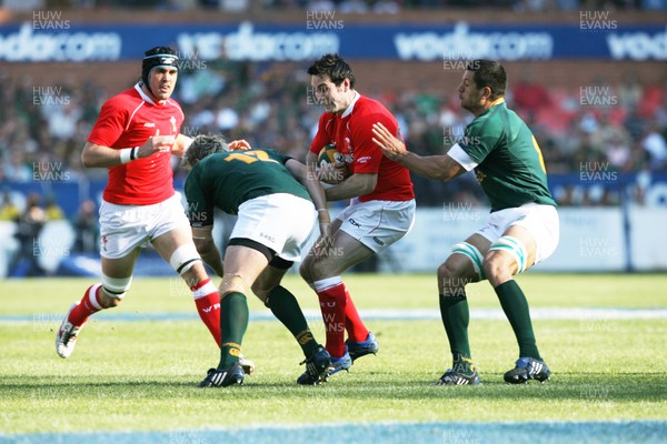 14.06.08 South Africa v Wales (Second Test)... Wales' Stephen Jones takes on South Africa's Jean de Villiers.  