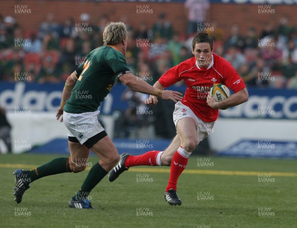 14.06.08 South Africa v Wales (Second Test)... Wales'  Andrew Bishop lines up South Africa's Jean de Villiers. 